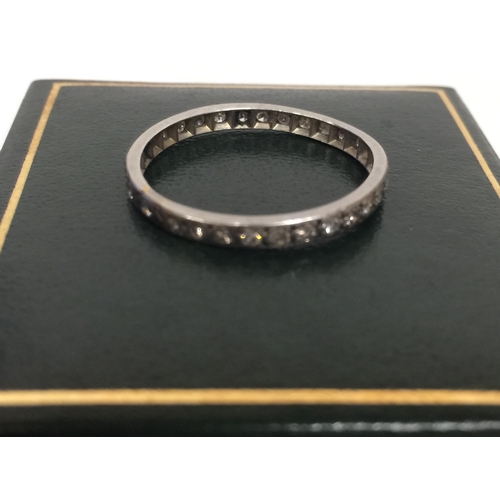 513 - AN 18CT GOLD ETERNITY RING