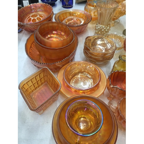 284 - A LARGE QUANTITY OF AMBER AND CARNIVAL GLASS TO INCLUDE BOWLS AND VASES, ETC