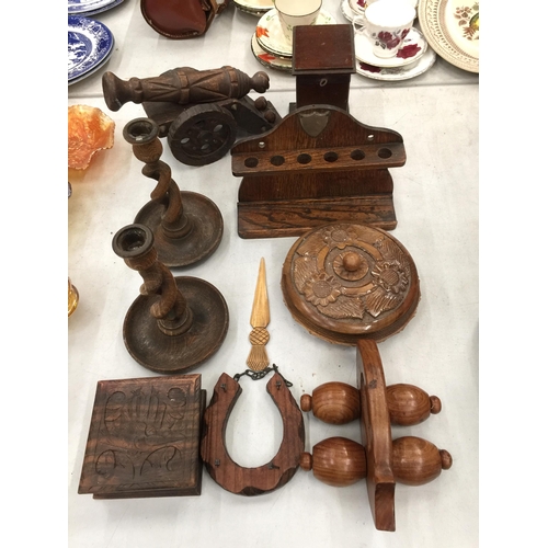 289 - A COLLECTION OF TREEN TO INCLUDE CANDLESTICKS WITH TWISTED STEMS, A PIPE RACK, CANON, BOXES, PAGE TU... 