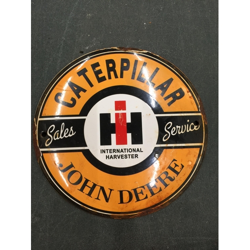 298 - A SMALL ENAMEL SIGN 'CATERPILLAR JOHN DEERE' DIAMETER 15CM