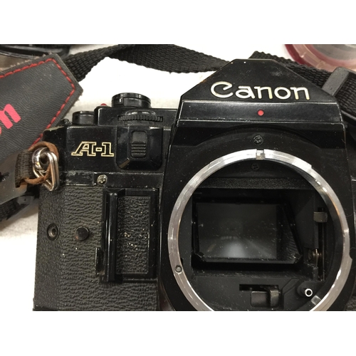 473 - A VINTAGE CANON A-1 CAMERA WITH LENS