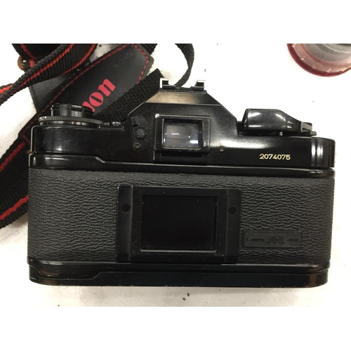 473 - A VINTAGE CANON A-1 CAMERA WITH LENS