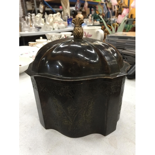 475 - A VINTAGE METAL TEA CADDY WITH FOLIATE ETCHING TO THE BASE AND A PINEAPPLE FINIAL