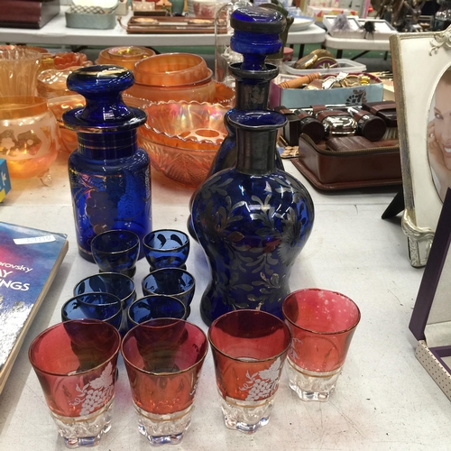 495 - A VINTAGE BLUE GLASS WITH GILT DECORATION DECANTER, STORAGE JAR, VASE AND GLASSES PLUS FOUR CRANBERR... 