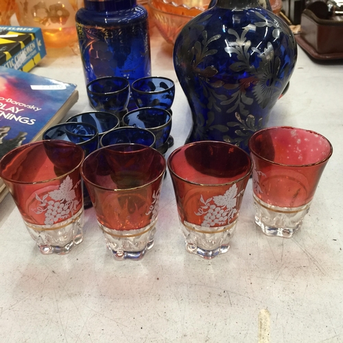 495 - A VINTAGE BLUE GLASS WITH GILT DECORATION DECANTER, STORAGE JAR, VASE AND GLASSES PLUS FOUR CRANBERR... 