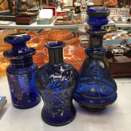 495 - A VINTAGE BLUE GLASS WITH GILT DECORATION DECANTER, STORAGE JAR, VASE AND GLASSES PLUS FOUR CRANBERR... 