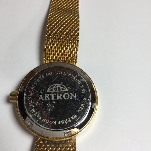 675 - AN ASTRON WATCH WITH SUB SECOND DIAL