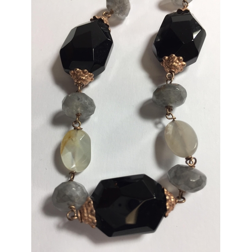 679 - ONE SILVER GILT AND AGATE NECKLACES