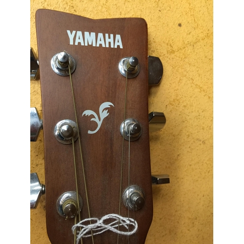 811 - A YAMAHA ACOUSTIC GUITAR