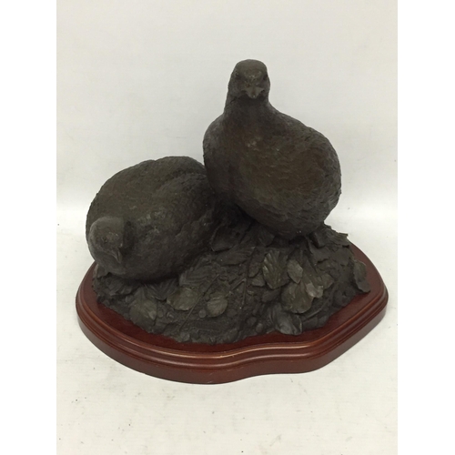 64 - A RESIN FIGURE OF TWO PARTRIDGES BY A.HAYMAN