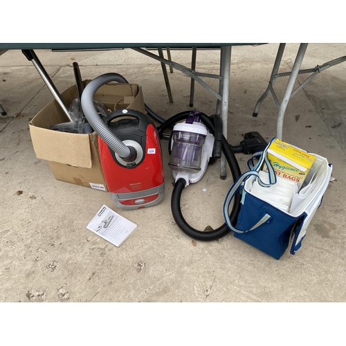 2376 - TWO VACUUM CLEANERS TO INCLUDE A MIELE AND A RUSSELL HOBBS AND AN ASSORTMENT OF ATTATCHMENTS