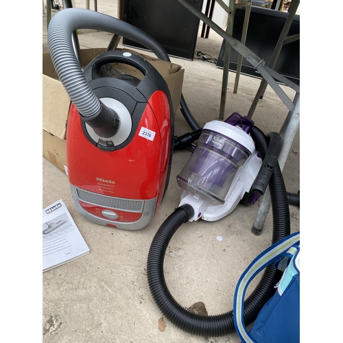2376 - TWO VACUUM CLEANERS TO INCLUDE A MIELE AND A RUSSELL HOBBS AND AN ASSORTMENT OF ATTATCHMENTS