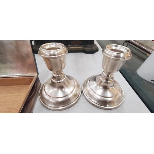 259 - A PAIR OF SILVER PLATED CANDLESTICKS AND A SILVER PLATED BOX