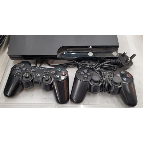 271 - A PS3 GAMES CONSOLE WITH 2 CONTROLLERS AND SIX GAMES TO INCLUDE GRAN TURISMO 5 CALL OF DUTY, OPERATI... 