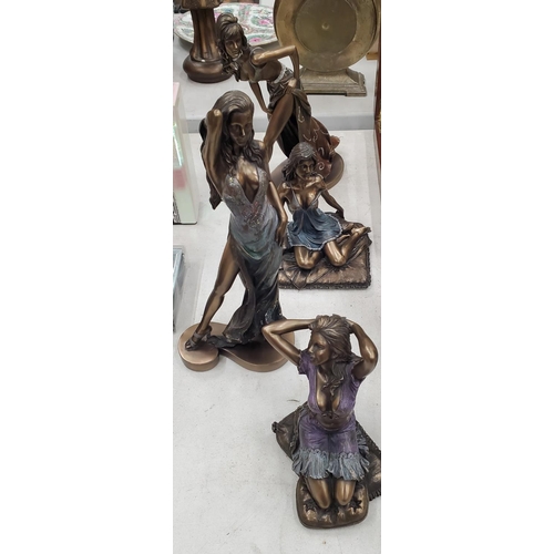 275 - FOUR LADY FIGURINES