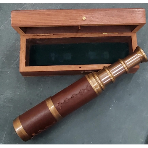 300 - A BOXED BRASS AND LEATHER TELESCOPE