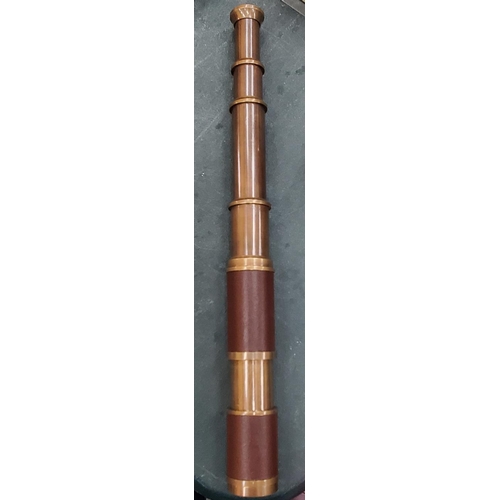 300 - A BOXED BRASS AND LEATHER TELESCOPE