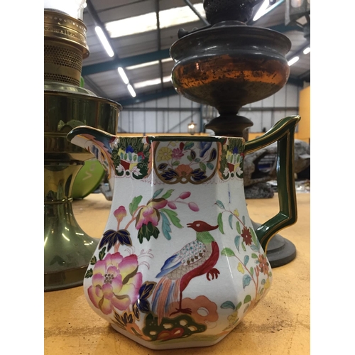 858 - TWO VINTAGE OIL LAMPS PLUS A MASONS IRINSTONE JUG IN AN ORIENTAL PATTERN