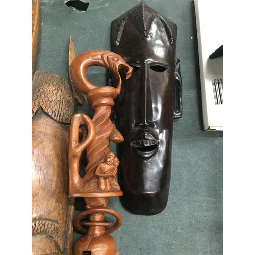 886 - TWO AFRICAN STYLE FACE MASKS PLUS A TRIBAL STYLE CARVED STICK WITH SERPENT DESIGN