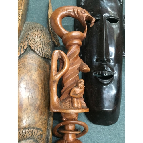 886 - TWO AFRICAN STYLE FACE MASKS PLUS A TRIBAL STYLE CARVED STICK WITH SERPENT DESIGN