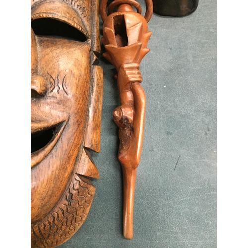 886 - TWO AFRICAN STYLE FACE MASKS PLUS A TRIBAL STYLE CARVED STICK WITH SERPENT DESIGN