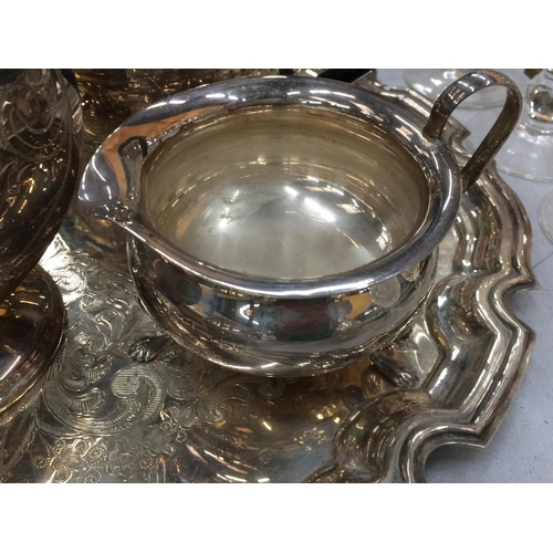 189 - A QUANTITY OF SILVER PLATE TO INCLUDE A TRAY WITH A TEAPOT, SUGAR BOWL, CREAM JUG,  ETC