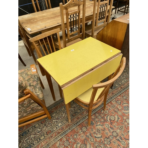 2908 - A 1950'S FORMICA TOP DROP-LEAF TABLE AND TWO CHAIRS