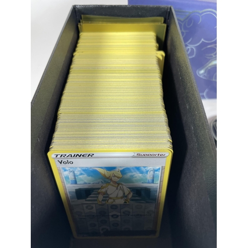 121 - A POKEMON TRAINER BOX FULL OF CARDS, HOLOS, TOKENS ETC