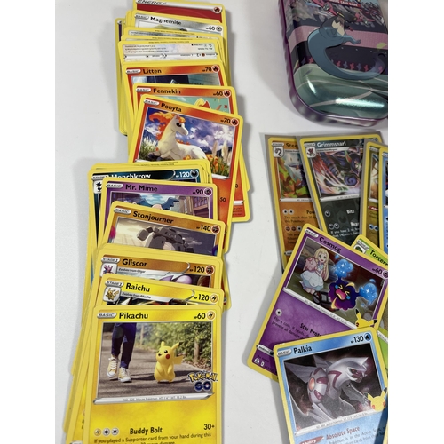 121 - A POKEMON TRAINER BOX FULL OF CARDS, HOLOS, TOKENS ETC