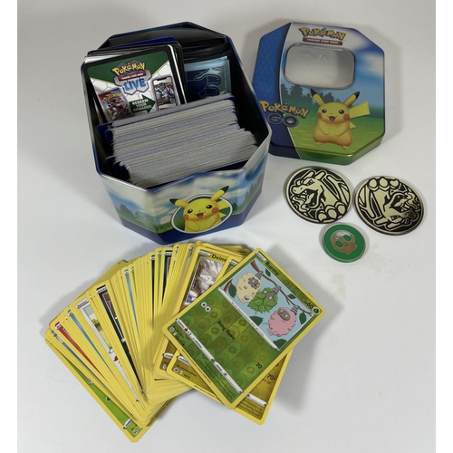 124 - A POKEMON GO PIKACHU TIN OF ASSORTED CARDS, SOME HOLOS, TOKENS ETC