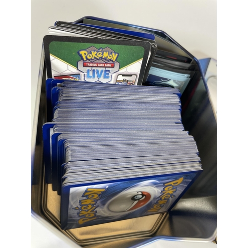 124 - A POKEMON GO PIKACHU TIN OF ASSORTED CARDS, SOME HOLOS, TOKENS ETC