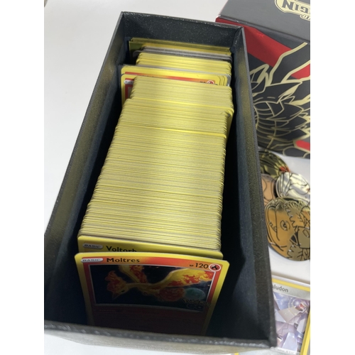 127 - A POKEMON TRAINER BOX FULL OF ASSORTED CARDS, HOLOS, TOKENS ETC