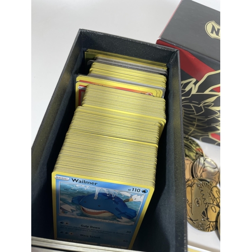 127 - A POKEMON TRAINER BOX FULL OF ASSORTED CARDS, HOLOS, TOKENS ETC