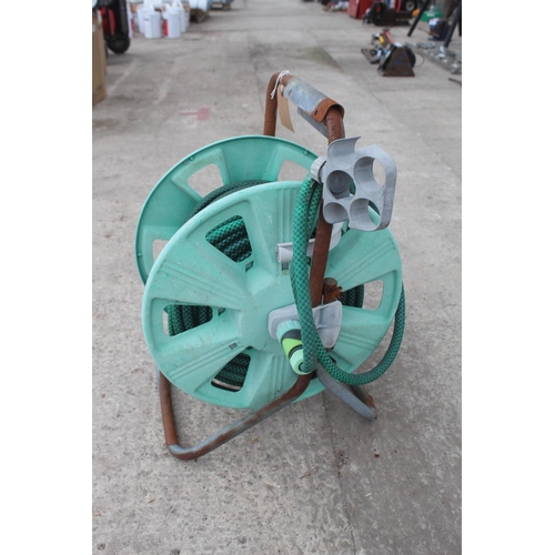 67 - GARDEN HOSE AND REEL (WORKING) NO VAT