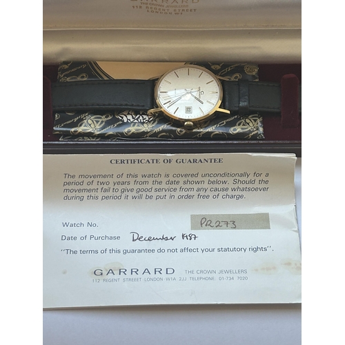 512 - A 9CT GOLD GARRARD GENTS WRIST WATCH WITH LEATHER STRAP AND ORIGINAL BOX AND PAPERS, WATCH NUMBER PR... 