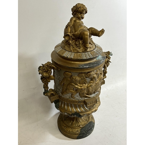 100 - A 19TH CENTURY BRONZE PEDESTAL URN WITH NEO-CLASSICAL RELIEF DESIGN ON FLUTED BASE WITH CHERUB FIGUR... 
