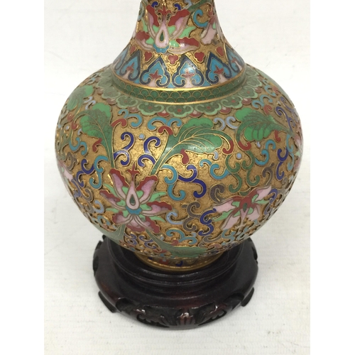 432 - A VINTAGE ORIENTAL CLOISONNE BOTTLE SHAPED VASE ON WOODEN STAND