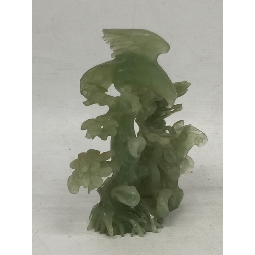 438 - A CHINESE ORIENTAL JADE TYPE CARVING