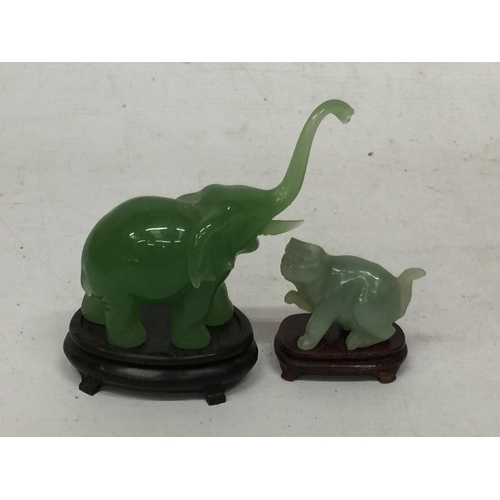 443 - TWO JADE TYPE ANIMAL FIGURES ON STANDS - ELEPHANT AND CAT