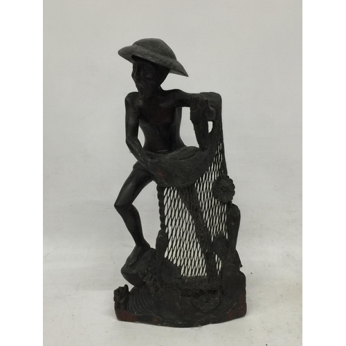 446 - A VINTAGE WOODEN ORIENTAL FISHERMAN FIGURE