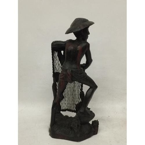 446 - A VINTAGE WOODEN ORIENTAL FISHERMAN FIGURE