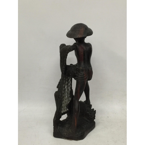 446 - A VINTAGE WOODEN ORIENTAL FISHERMAN FIGURE