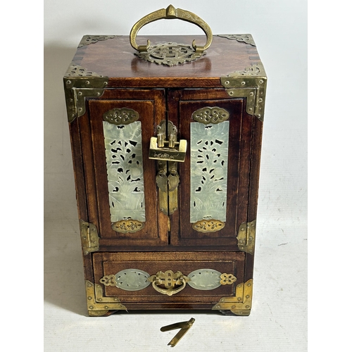 99 - AN ORIENTAL JEWELLERY CABINET, WITH HIDDEN DRAWERS AND BRASS FITTINGS, ALONG WITH JADE STYLE INSERTS... 