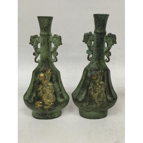 447 - A PAIR OF ORIENTAL BRONZE DRAGON VASES