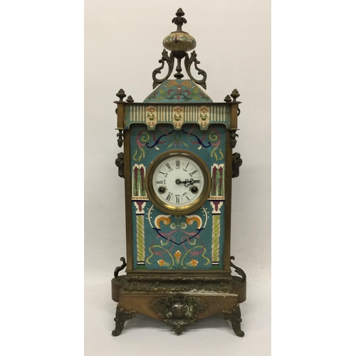 1 - AN ART NOUVEAU CLOISONNE AND BRASS CHIMING MANTLE CLOCK WITH RAM HEAD SIDE DESIGN