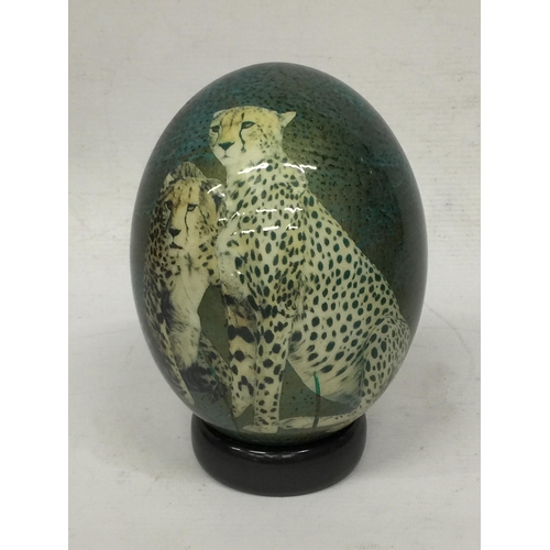 15 - A HAND PAINTED OSTRICH EGG WITH CHEETAH DESIGN  ON STAND