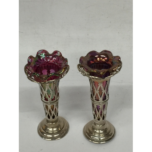 3 - A PAIR OF CHESTER HALLMARKED SILVER BUD VASES WITH PINK LUSTRE EFFECT GLASS LINERS