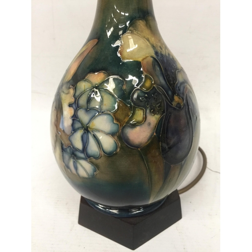 58 - A WALTER MOORCROFT FLORAL BOTTLE SHAPED TABLE LAMP