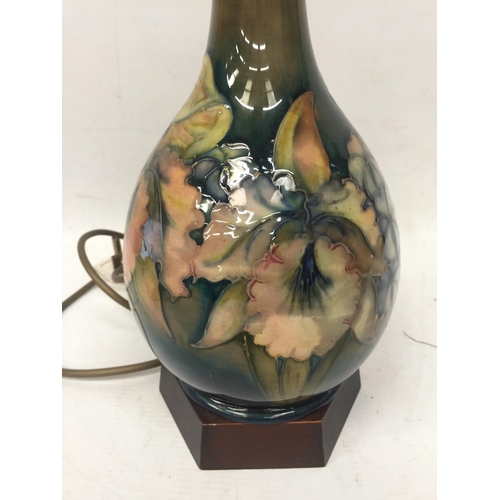 58 - A WALTER MOORCROFT FLORAL BOTTLE SHAPED TABLE LAMP