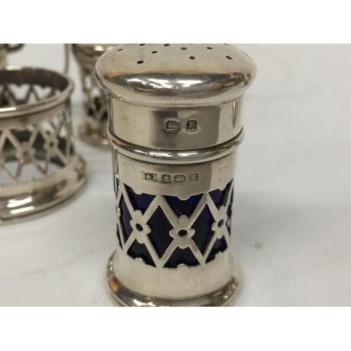 7 - A SET OF FIVE HALLMARKED SILVER CONDIMENT ITEMS - LIDDED POTS, OPEN SALT AND SHAKERS